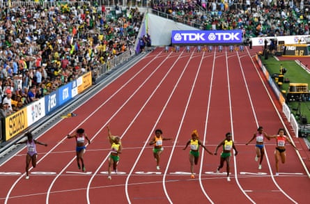Shelly-Ann Fraser-Pryce of Jamaica, third from left, crosses the line.