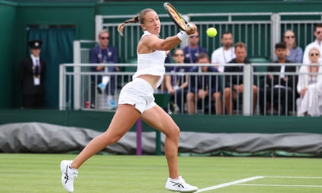 Diane Parry plays a shot in shorts.