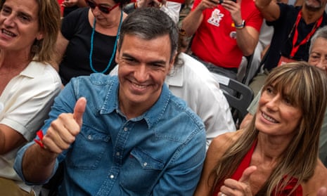 Spain’s prime minister Pedro Sánchez next to his wife, Begona Gomez, gives a thumb up during a campaign closing meeting in Madrid, Spain, Friday, 21 July 2023.