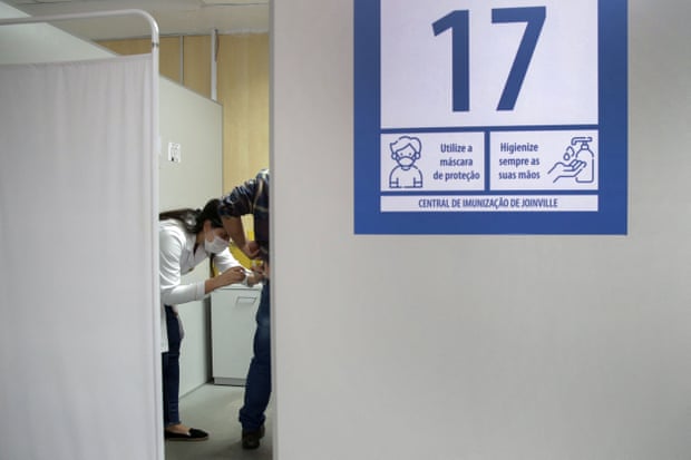 A man receives a Covid vaccine at a health centre in Joinville, Santa Catarina.