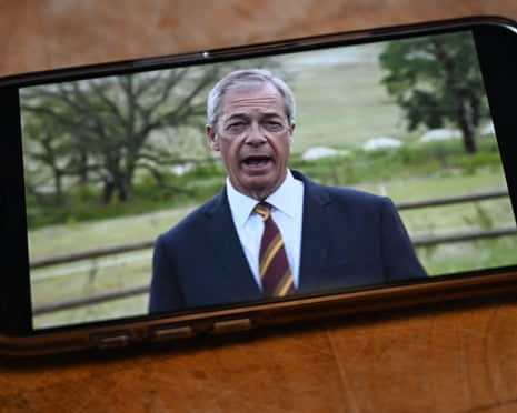 A phone showing Nigel Farage footage