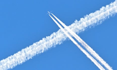 Condensation trails of airplanes are seen in the sky