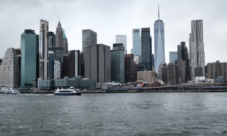 The Manhattan skyline looms over the East River.