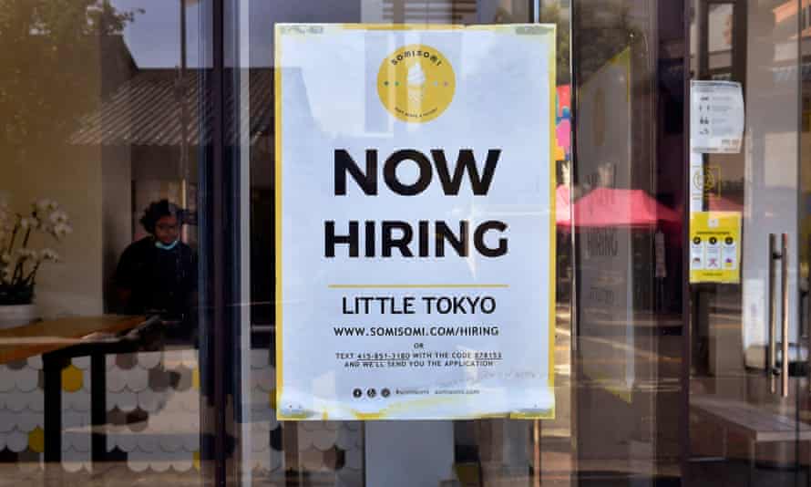 A 'Now Hiring' sign is posted in front of an ice-cream shop in Los Angeles, California in May 2021.