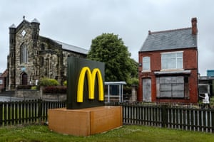 A photograph by Merlin Daleman of a McDonalds next to a boarded-up house in Dudley, October 2017