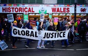 Banner reads Global Justice