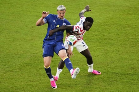Folarin Balogun catches Bosnia and Herzegovina’s Tarik Muharemovic on the back of his ankle