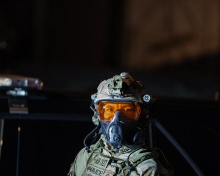 An ICE agent wearing protective gear