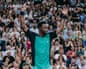 Fans salute Gael Monfils after his straight-sets defeat by Learner Tien in the second round of the US Open.