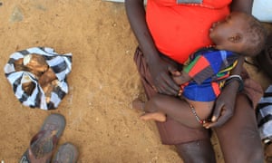 A mother and child at the UNHCR-managed refugees reception point at Elegu, Uganda