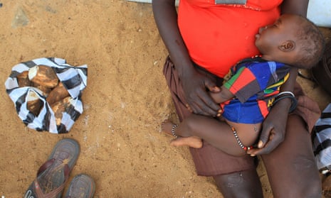 A mother and child at the UNHCR-managed refugees reception point at Elegu, Uganda