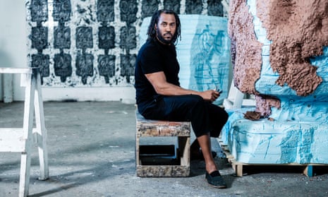Rashid Johnson works on one of his sculptures in his studio.