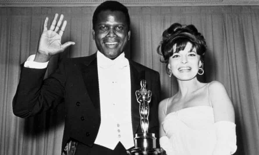 Poitier with Anne Bancroft after winning the best actor Oscar in 1964.