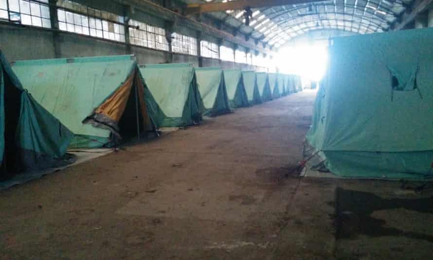 A row of tents installed to house refugees in an abandoned factory in Sindos