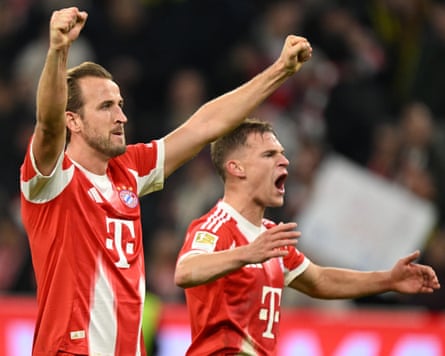 Harry Kane and Joshua Kimmich celebrate after the Bundesliga match between Bayern Munich and Borussia Dortmund