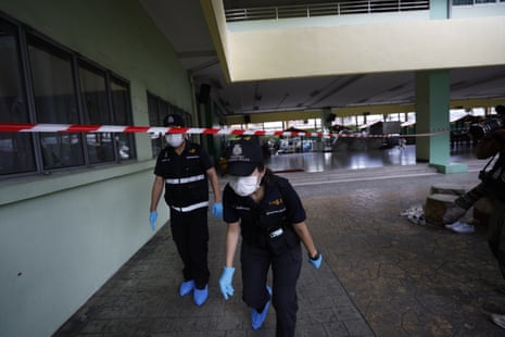 Forensic police conduct investigations after the school shooting at the Debsirin School.