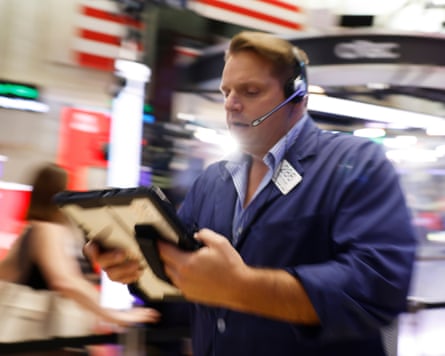 Traders work on the floor of the New York Stock Exchange.