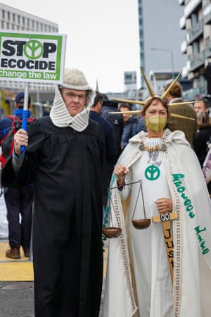Protestors outside the Cop26 venue dressed as judge and the scales of justice.