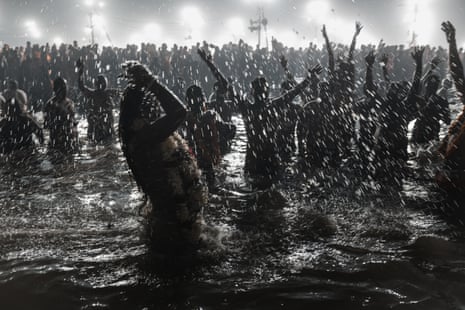 Hindu pilgrims bathing at the Kumbh Mela, a ritual postponed after a deadly stampede killed dozens of pilgrims