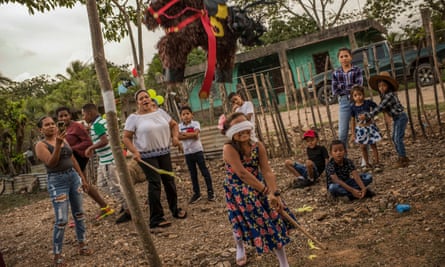 A birthday party in Chapagua village, Trujillo, Colon, Honduras. Octuber 17, 2021. People of Bajo Aguan, a region of Honduras’ department of Colon, besides historic social conflict due to contended land ownership between peasant communities and powerful oligarchy families who nowadays are exploiting land with huge oil palm plantations, they are also suffering from natural phenomena caused by climate change. In the last decades, several storms and hurricanes affected millions of people, mostly among the highest vulnerable villages around Aguan river. Latest hurricanes, Eta and Iota, late in 2020, flooded several villages and many families had to leave their homes.