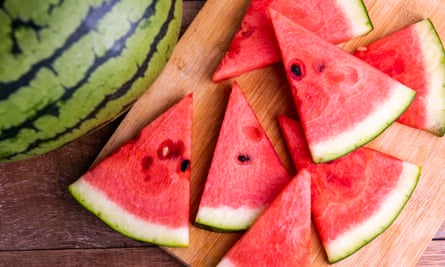 Fresh ripe watermelon slices on wooden table.