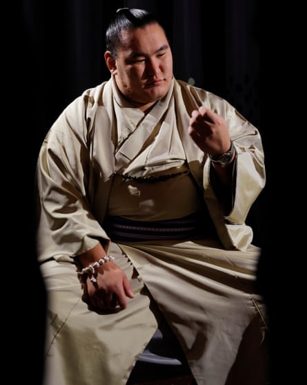 Hoshoryu, the other yokozuna, rests on a chair during a round of interviews in the Royal Albert Hall