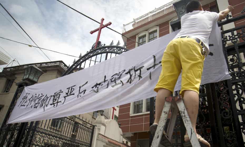 Christians protest at the removal of crosses from their church in Yongjia in eastern China’s Zhejiang province. 