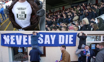 A fan proudly shows off his T-shirt; the Hartlepool fans in the bumper 7,000 crowd cheer their team on; Hartlepool fans put up a banner outside of the Mill House pub.