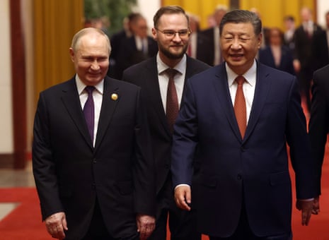 Vladimir Putin and Xi Jinping talk prior to their bilateral meeting in Beijing.