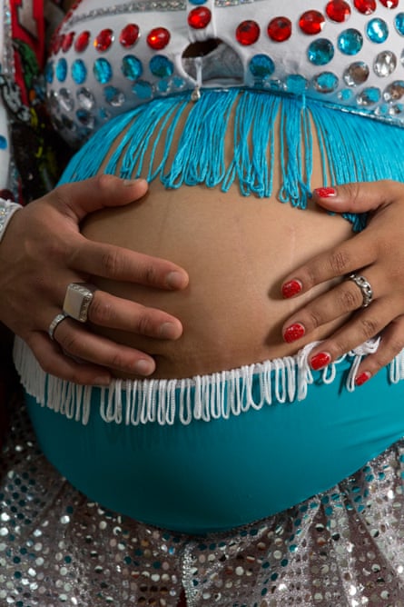 Paola poses, almost nine months pregnant, in her murga suit.