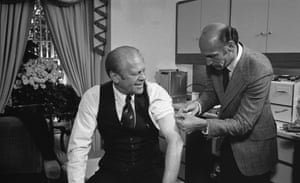 President Gerald Ford receives a swine flu inoculation from his White House physician, Dr William Lukash.