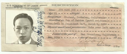 A paper ID card, with a square, black-and-white photo of a young man on the left.