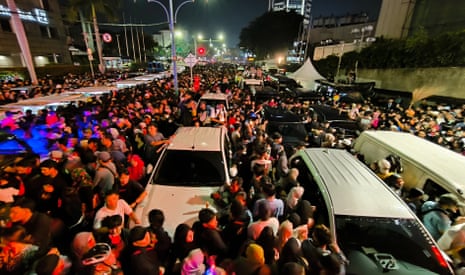 Residents gather for New Year’s eve celebration at a main roundabout in Jakarta, Indonesia.