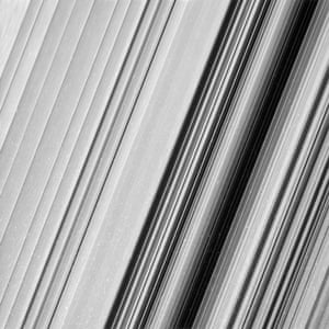 A region in Saturn’s outer B ring. The many small, bright blemishes are created by cosmic rays and charged particle radiation near the planet.