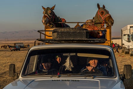A landowner, his son and his brother leave the vast plain surrounding Tarraz, where a richly endowed kokpar – an ancient equestrian game – was organised. In a trailer attached to the landowner’s old Lada stand his two horses with their heads covered to protect them from the biting evening wind on their way back.