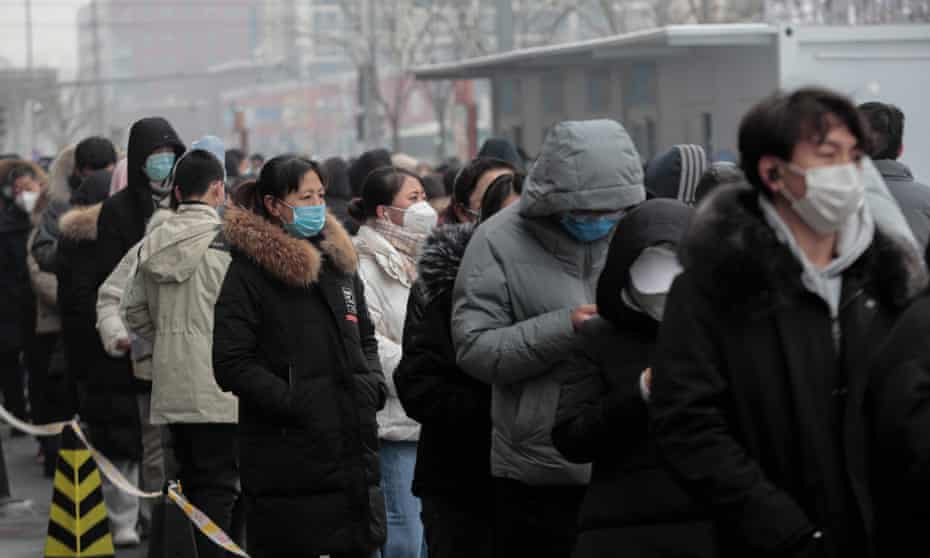 Residents of Beijing’s Fengtai district queue up to get  nucleic acid Covid tests.