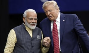 Donald Trump shakes hands with Indian Prime Minister Narendra Modi.