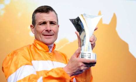 Pat Smullen holds the trophy after winning the Darley Irish Oaks on Covert Love in 2015. 