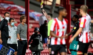 Brentford manager Thomas Frank gets a yellow card.