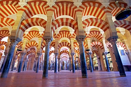 Multiple columns and striped arches inside the Mezquita