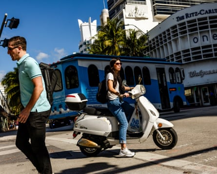 Motorists cruise along Collins Avenue