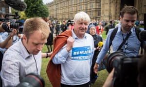 Stanley Johnson, the father of Boris Johnson, speaks to journalists outside the Houses of Parliament in a remain sweatshirt