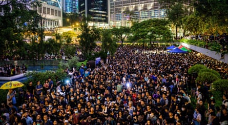 A large crowd of people in an urban park