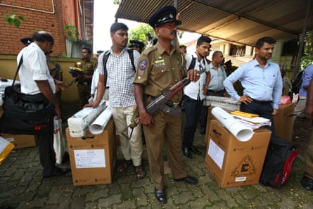 Security personnel escort Sri Lankan polling officers carrying election materials as they leave for their respective polling booths on the eve of the presidential elections in Colombo, Sri Lanka, 15 November 2019.