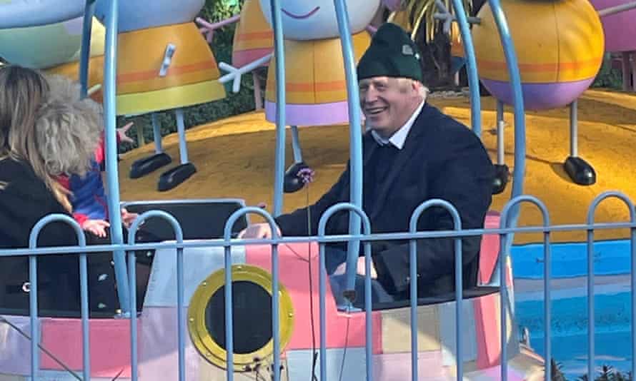 Boris Johnson enjoys a ride with his wife Carrie Johnson and son at Peppa Pig World.