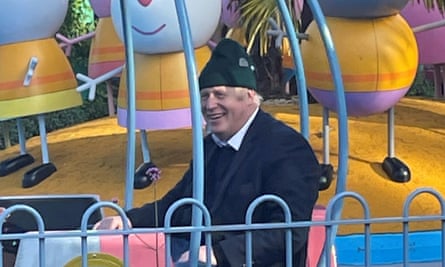 Boris Johnson enjoys a ride at Peppa Pig World.