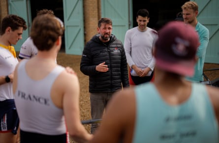 Rob Baker, the men’s chief coach for the Cambridge University Boat Club, talks to his blue boat at their Ely training site in Cambridgeshire on 20 March 2024.