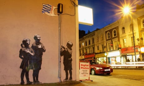 Banksy’s 2008 mural on a wall on Essex Road, north London, depicting children gathering around a flagpole flying a Tesco carrier bag.