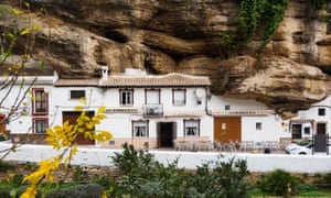 Setenil de las Bodegas, where dwellings are built into rock overhangs above the Rio Trejo.