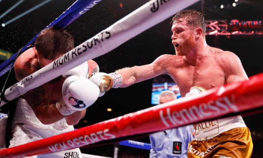 Álvarez forces Caleb Plant on to the ropes during their bout in Las Vegas.